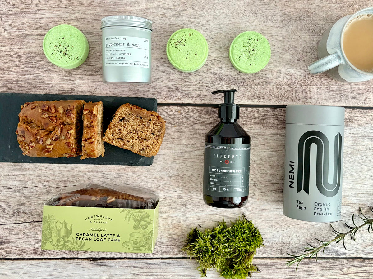 Reset Gender neutral care package gift set with cake, organic tea, shower steamers and body wash