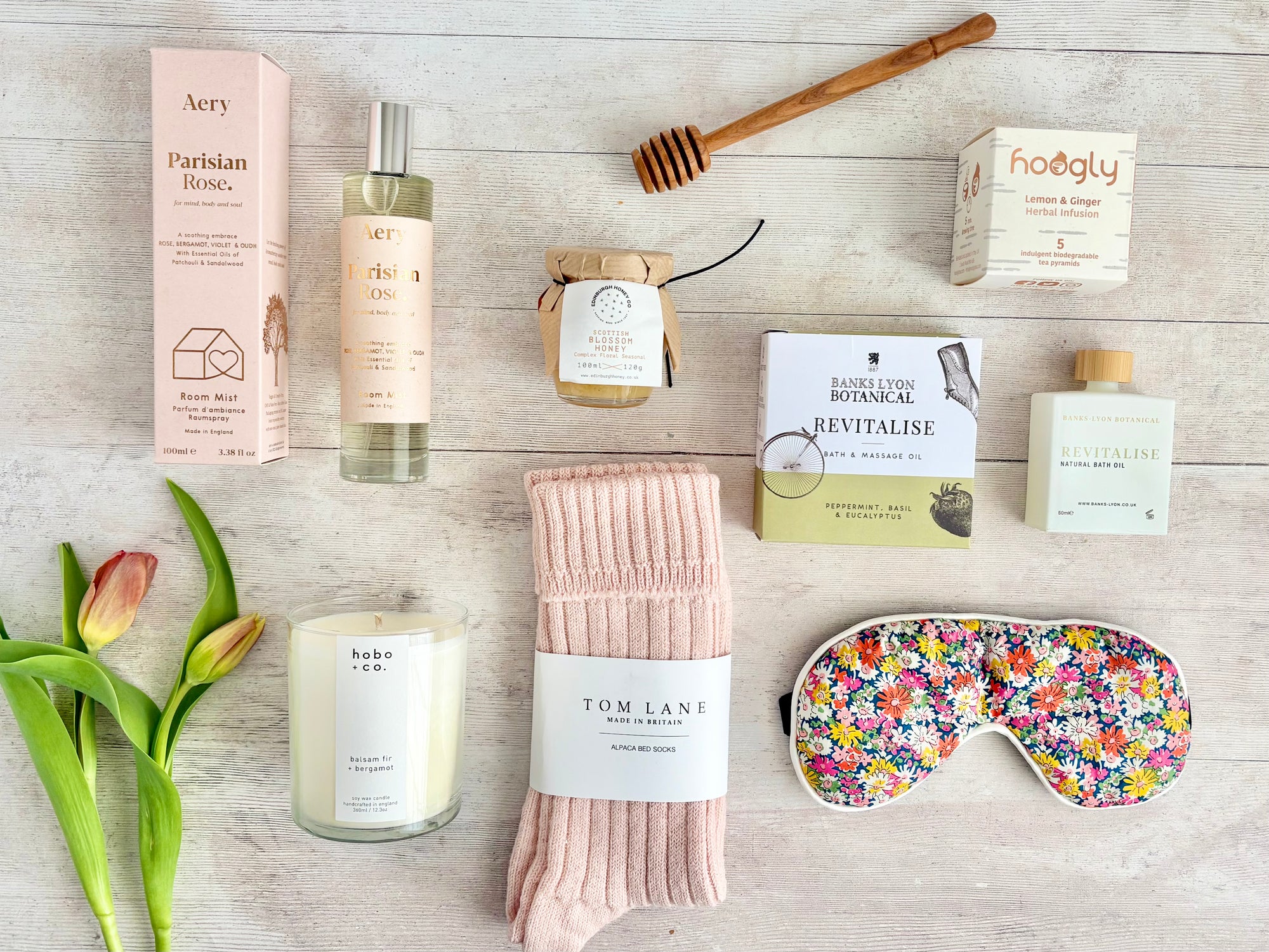 Wellbeing hamper with bath oil, herbal tea, alpaca socks, sleep mask, honey, candle and room mist